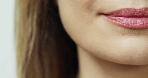 Close up of the right bottom part of face of the Caucasian happy woman who Stock Footage 111520351