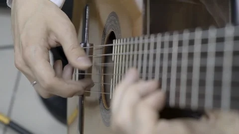 Close up of right hand playing guitar Stock Footage 114633233