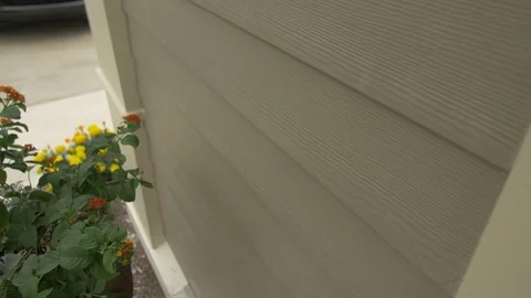 Close-up Right Pan of Tan Siding Stock Footage 100898756