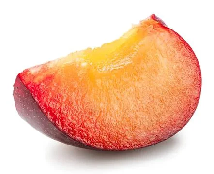 Close-up of a ripe peach slice on white background Stock Photos