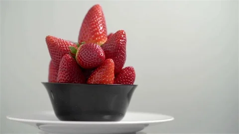 Close up of ripe strawberries rotating over white background Stock Footage 71538443