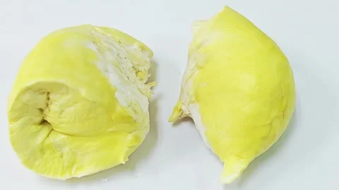Close up of ripe yellow durian pulp on white background. 스톡 동영상 339199935