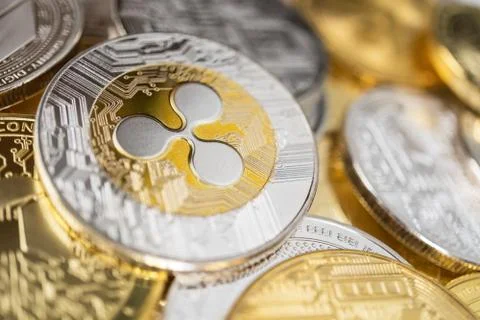 Close-up of ripple physical coin on stack of many other cryptocurrencies Stock Photos