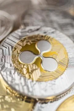 Close-up of ripple physical coin on stack of many other cryptocurrencies Stock Photos