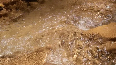 Close up of ripples in clear, shallow river 1 water Stock Footage 321325697