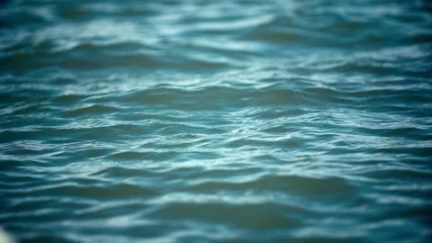 Close-up of rippling waves on the surface of the water and lake Vídeo Stock 257164854