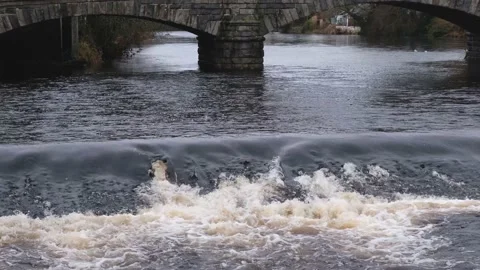 Close up of the River Cree flowing over the weir at Newton Stewart Stock Footage 169505220