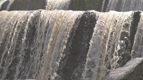 Close up of a river falling into a waterfall Stock Footage 234940953