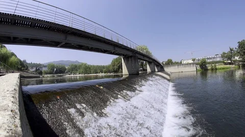 Close up of river floating with small waterfall during day time, Portugal Stock-Footage 128967433