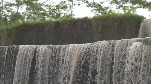 Close up of a river flowing down to form a beautiful waterfall Stock Footage 234945468