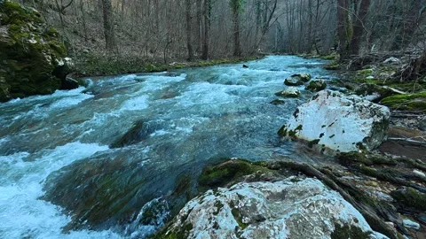 Close-Up River Flowing Downstream With White Rock Foreground – Autumn Video stock 330951932