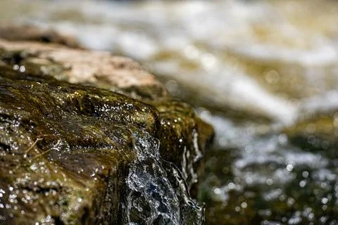 Close up of river rapids flowing over rocks Stock Photos