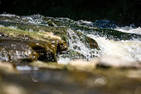 Close up of river rapids flowing over rocks Stock Photos