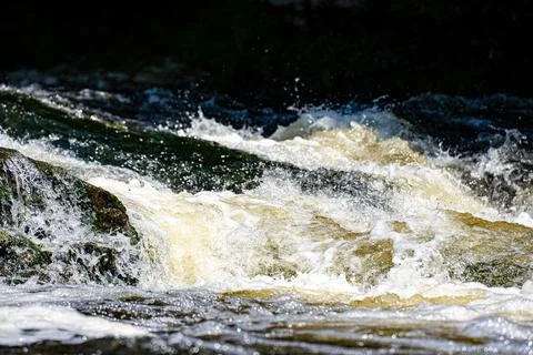 Close up of river rapids flowing over rocks Stock Photos