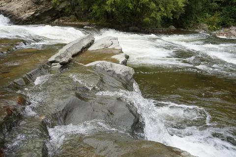 Close-up of river rapids over rocks. Stock Photos