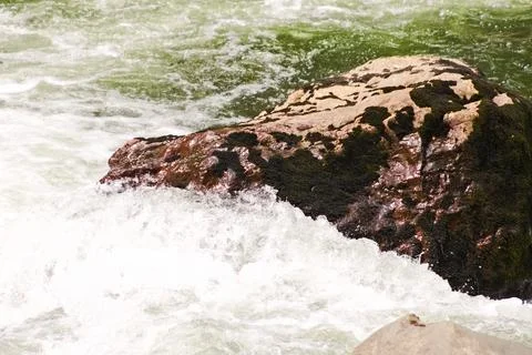 Close-up of river rocks surrounded by rushing water near Snoqualmie Stock Photos