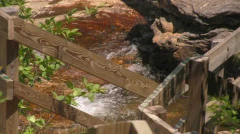 Close-up of River Running Behind Wooden Stairs Stock Footage 12758228