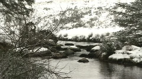 Close up of a river running through a snowy landscape Video stock 20738288