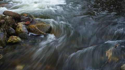 Close up of river with stones 4k timelapse Stock Footage 61223399