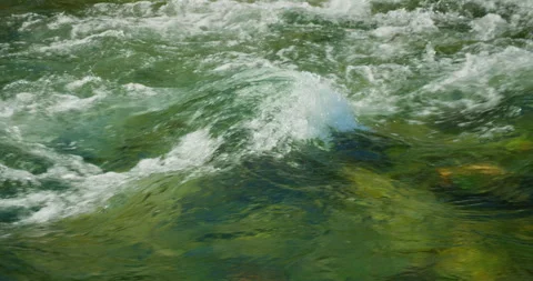 Close-up of river surface with splashing crystal clear spring water waves Stock Footage 313306125