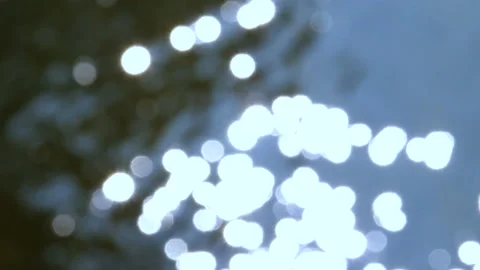 Close Up Of River Water Reflecting Dancing Sun Spots Moving Around Out Of Focus Stock Footage 200272112