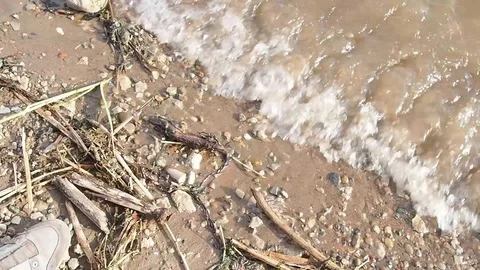 Close up for river waves on a sandy shore. Stock footage. Stock Footage 114751452