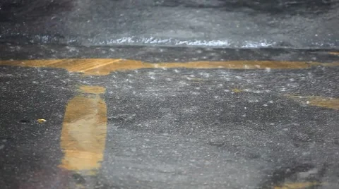 Close up of Road in the city centre during torrential rain. Blurred background. Stock Footage 44476879
