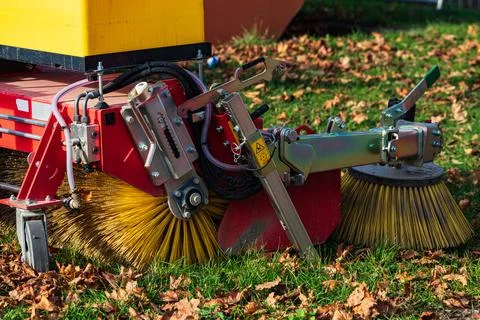Close-up of road cleaning machine brushes during autumn season Stock Photos