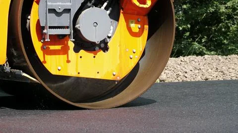 Close-up, Road construction works with roller compactor machine , asphalt Stock Photos