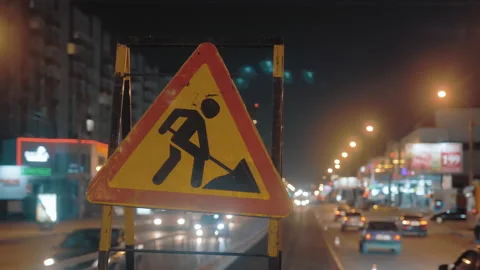 Close-up of a road sign warning drivers about road works. Grunge road traffic Stock Footage 154962785