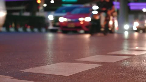 Close up of road surface marking on asphalt in Bangkok city at night rush hour 스톡 동영상 310164205