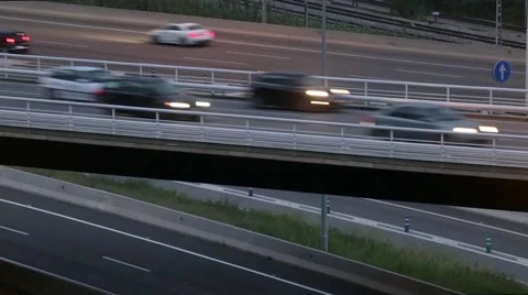 Close-up road traffic scene with bridge in the dusk.Time lapse Stock Footage 63335254