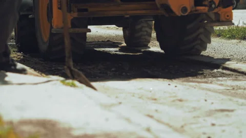 Close up Road workers prepare pavement for laying a repair patch on the asphalt Stock Footage 242167765