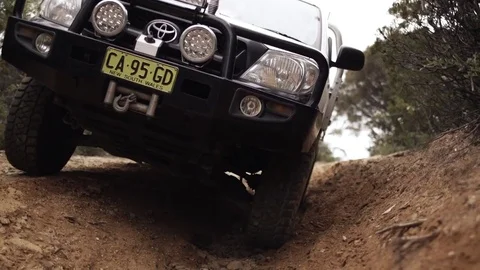 Close up of off roading in a 4WD down a hill in a forest Stock Footage 81603304
