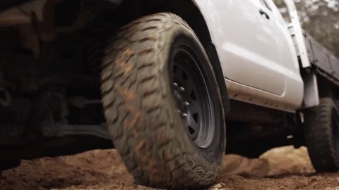 Close up of off roading in a 4WD in a forest with wheel spin Video stock 81603111