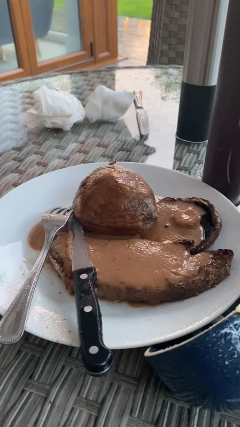 Close Up Roast Dinner on Outdoor Patio Table During Rainy Weather Stock Footage 346751233