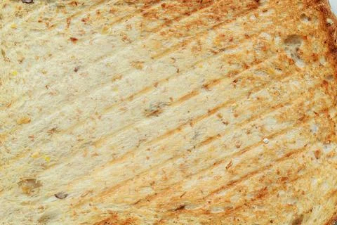 Close up roasted bread background texture. Macro photo top view. Stock Photos