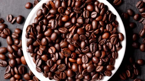 Close up of roasted brown coffee beans rotating Stock Footage 151025004