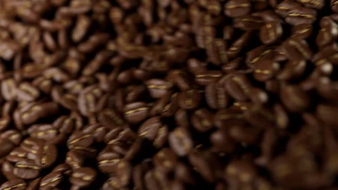 Close up of roasted brown coffee beans falling. Stock-Footage 328608921