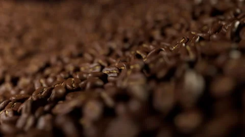 Close up of roasted brown coffee beans falling Video stock 328608947