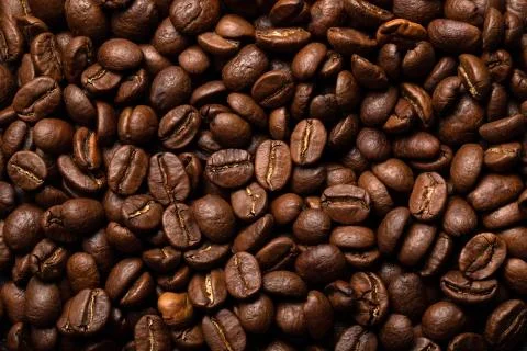 Close-up roasted coffee beans background. Top view Stock Photos