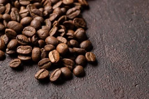 Close-up roasted coffee beans background. Top view with copy space Stock Photos