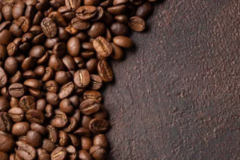 Close-up roasted coffee beans background. Top view with copy space Stock-Fotos