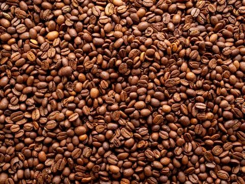 Close-up roasted coffee beans background, top view, copy space Stock Photos
