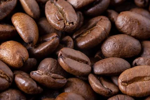 Close-up of roasted coffee beans as background. Stock Photos
