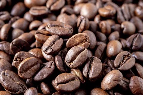 Close-up of roasted coffee beans as background. Stock Photos