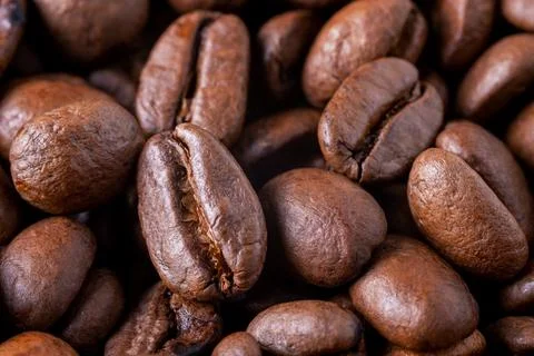 Close-up of roasted coffee beans as background. Stock Photos