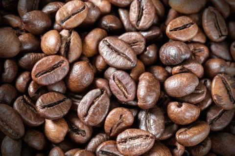 Close-up of roasted coffee beans, background, texture. Good mood. Coffee aroma Stock Photos