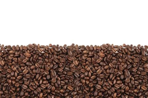 Close-up of roasted coffee beans over white background Stock-Fotos
