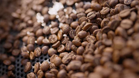 Close Up roasted coffee beans pattern of texture. Raw coffee slow Motion on Stock Footage 129311312